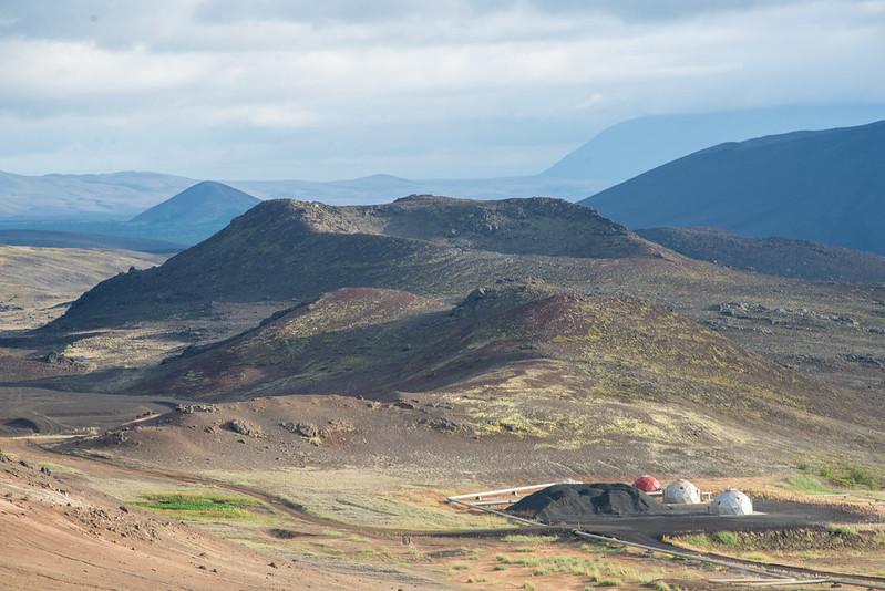 A cluster of geodesic domes set into an Icelandic landscape.